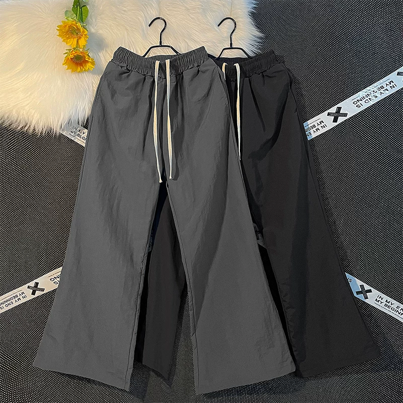 Quần nam nhẹ, nhanh khô, kiểu dáng thường ngày, quần ống loe rộng rãi mùa hè, phong cách Mỹ thời thượng, quần dù thể thao.
