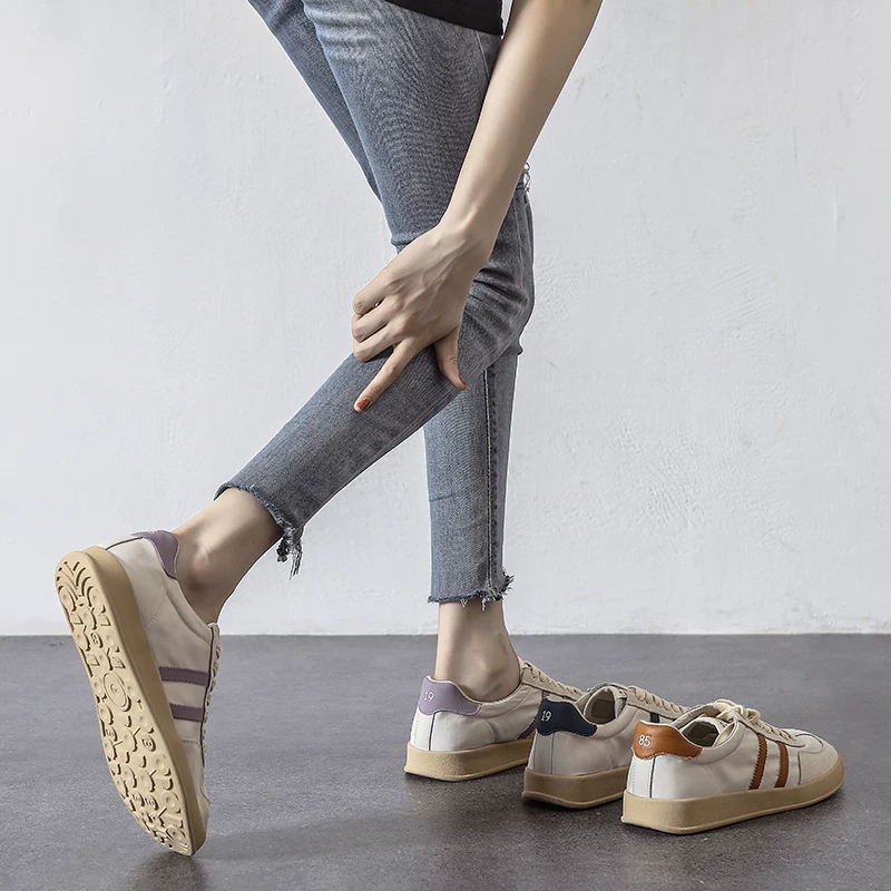 Giày thể thao nữ mùa hè chất liệu vải lưới tơ tằm mỏng thoáng khí màu trắng mẫu mới 2026 đế mềm êm chân thoải mái phong cách thể thao thường ngày