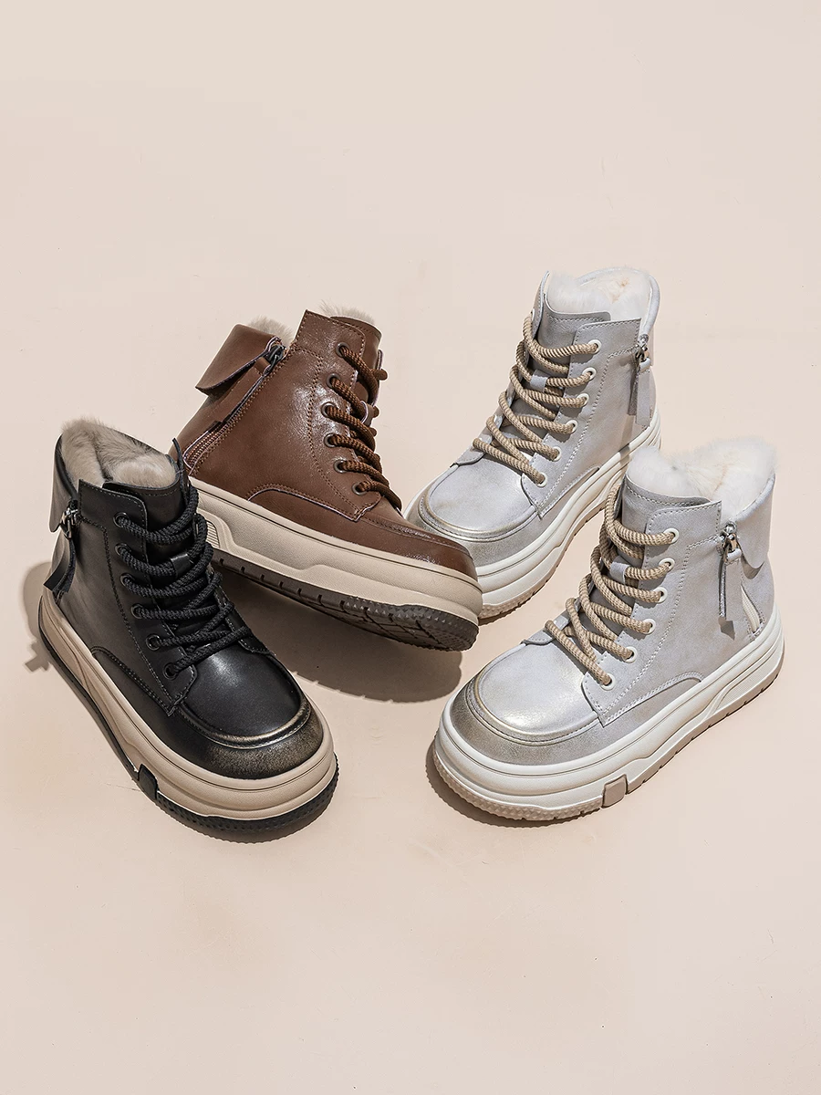 Giày bốt tuyết đế dày bằng da thật dành cho nữ, lót lông cừu và giày cotton cổ cao dày dặn, kiểu mới mùa đông 2025, bốt ngắn lông thú phong cách thể thao năng động.