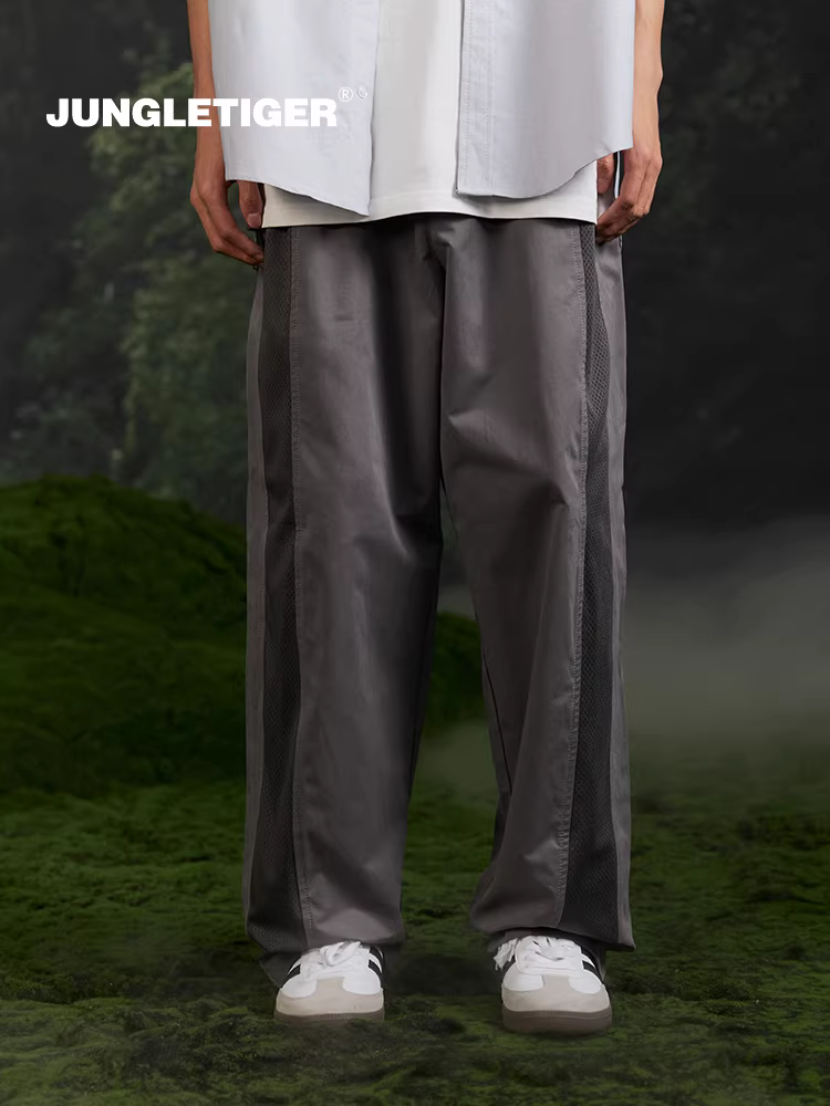Quần thể thao nam dáng rộng phong cách đường phố mới 2025, kiểu phối màu chắp vá thời thượng Jungle Tiger