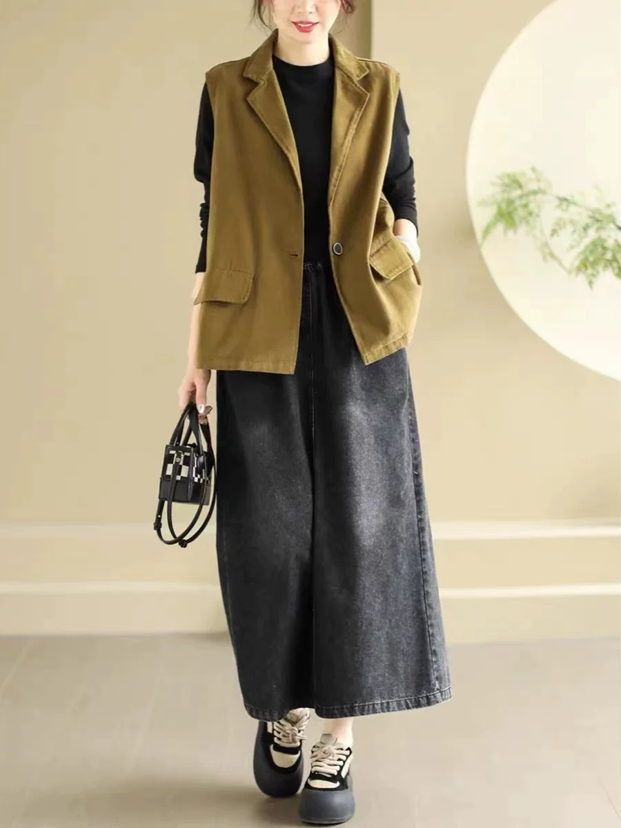 Chân váy nữ xuân 2026 kiểu vintage, denim xước, dáng đơn giản, tôn dáng, lưng thun, thanh lịch, dài.
