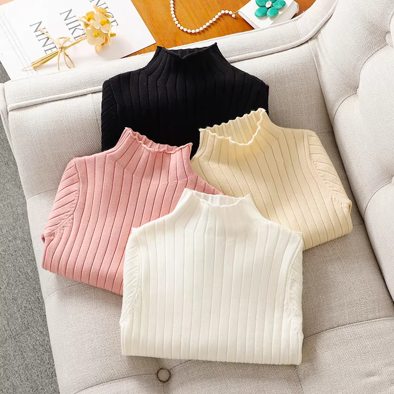 Áo len trẻ em xuân thu 2025 kiểu mới, áo len trắng cổ lọ nửa cao cho bé gái lớn, mặc trong mùa thu đông