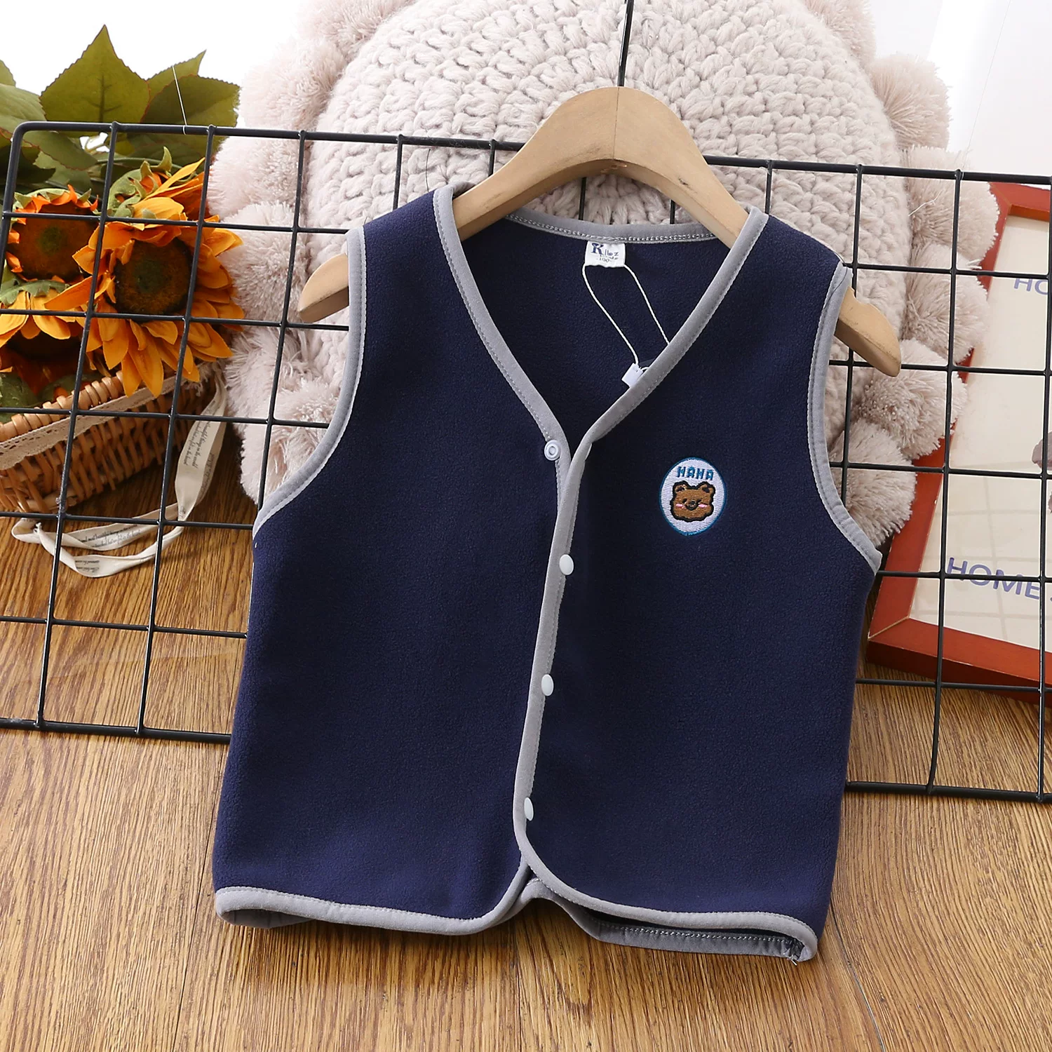 Áo vest trẻ em mùa xuân đông sản phẩm mới Áo len co giãn lông cừu Úc cổ chữ V thời trang bé trai và bé gái áo không tay hợp thời trang