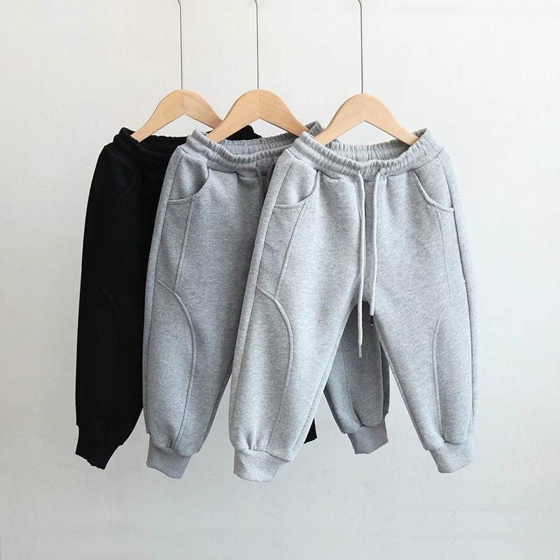 Quần thể thao trẻ em xuân thu 2025 kiểu Hàn Quốc mới, quần jogger cotton nguyên chất thời trang cho bé trai và bé gái