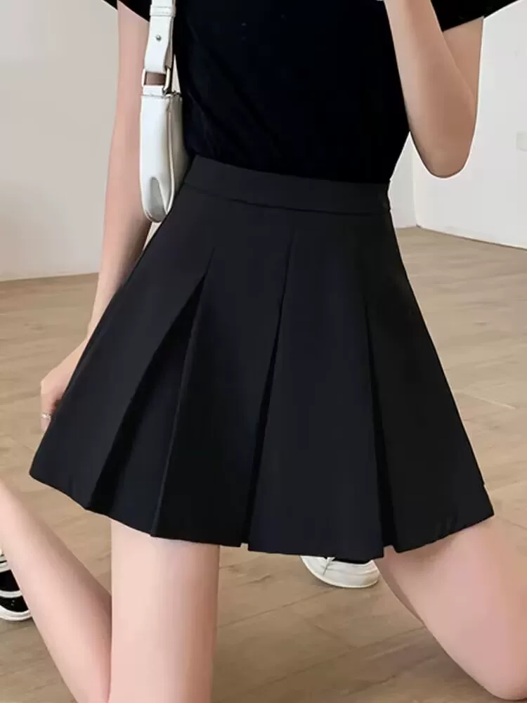 Váy xếp ly màu đen cỡ lớn, váy ngắn chữ A mùa xuân hè dành cho nữ, váy cạp cao kiểu đại học, giúp thon gọn và che bụng.