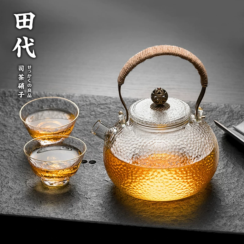 Ấm trà thủy tinh borosilicate cao cấp chịu nhiệt 700ml, họa tiết búa, tay cầm đồng, hình tròn, làm thủ công, có vòi ngắn và bộ lọc để pha trà.
