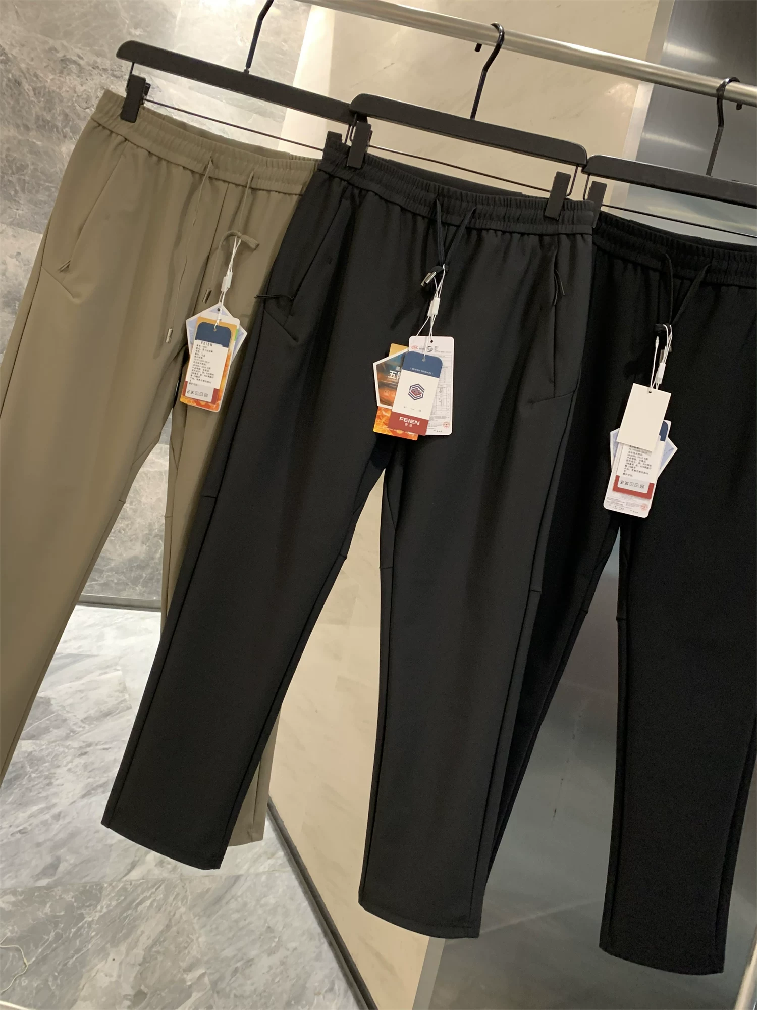 Vải ba lớp chống thấm Don Quixote Tech! Quần thể thao đa năng liền mạch dành cho nam mùa xuân thu, quần dài thời trang