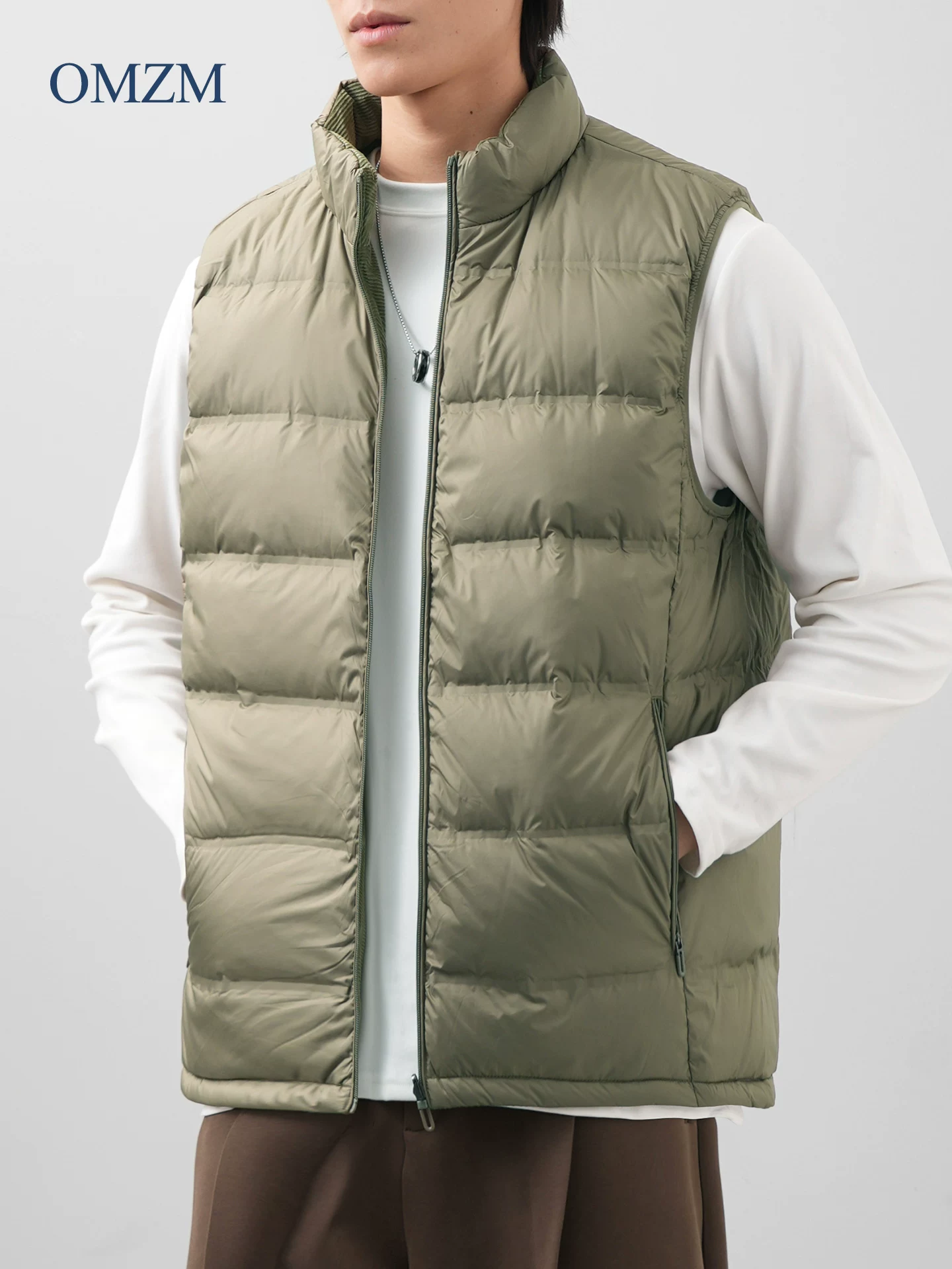 Áo vest nam OMZM có thể đảo ngược 90% lông vịt, áo khoác không tay có gân ấm áp phong cách Mỹ mùa đông có cổ đứng.