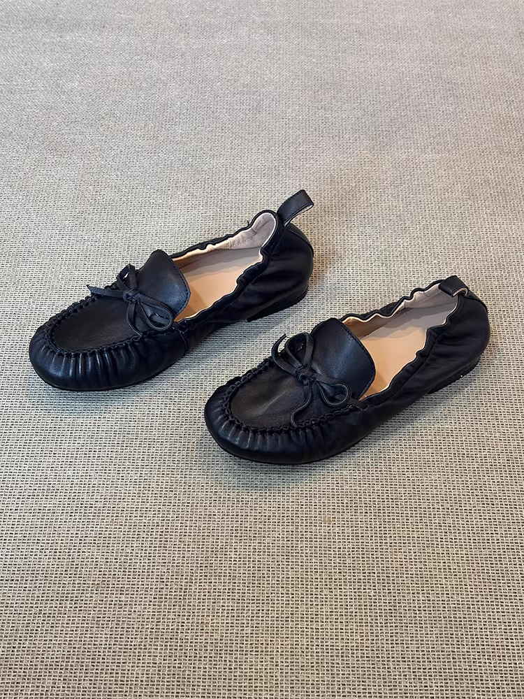 Phiên bản da cừu ~ Giày lười da thật có nơ màu đen mũi tròn dành cho nữ, giày đế mềm xếp ly thoải mái, kiểu dáng dễ mang