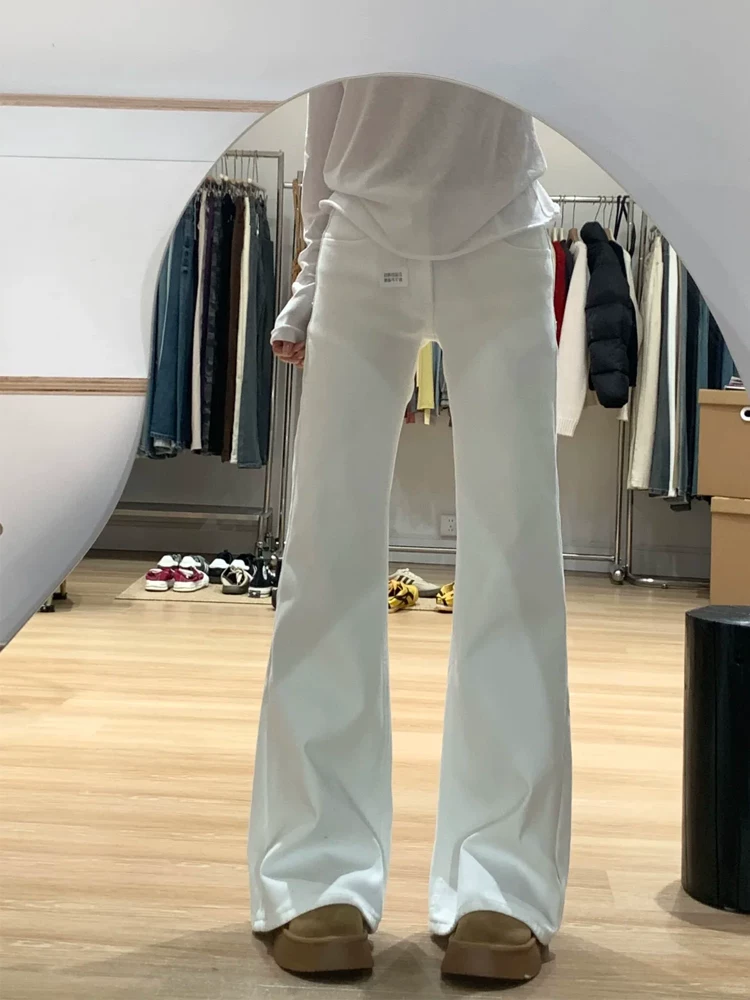 Quần jean loe nữ không bó sát chân, kiểu mới thu đông 2025, size lớn, cạp cao, co giãn, tôn dáng, quần ống chuông màu trắng