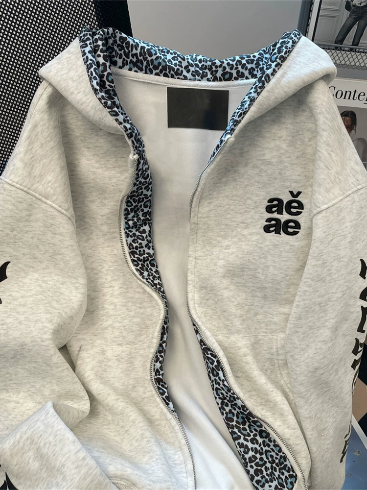 Áo nỉ có mũ trùm đầu in chữ theo phong cách Gothic của châu Âu và Mỹ dành cho nữ, áo khoác cardigan chắp vá họa tiết da báo hip-hop mùa thu đông của Mỹ