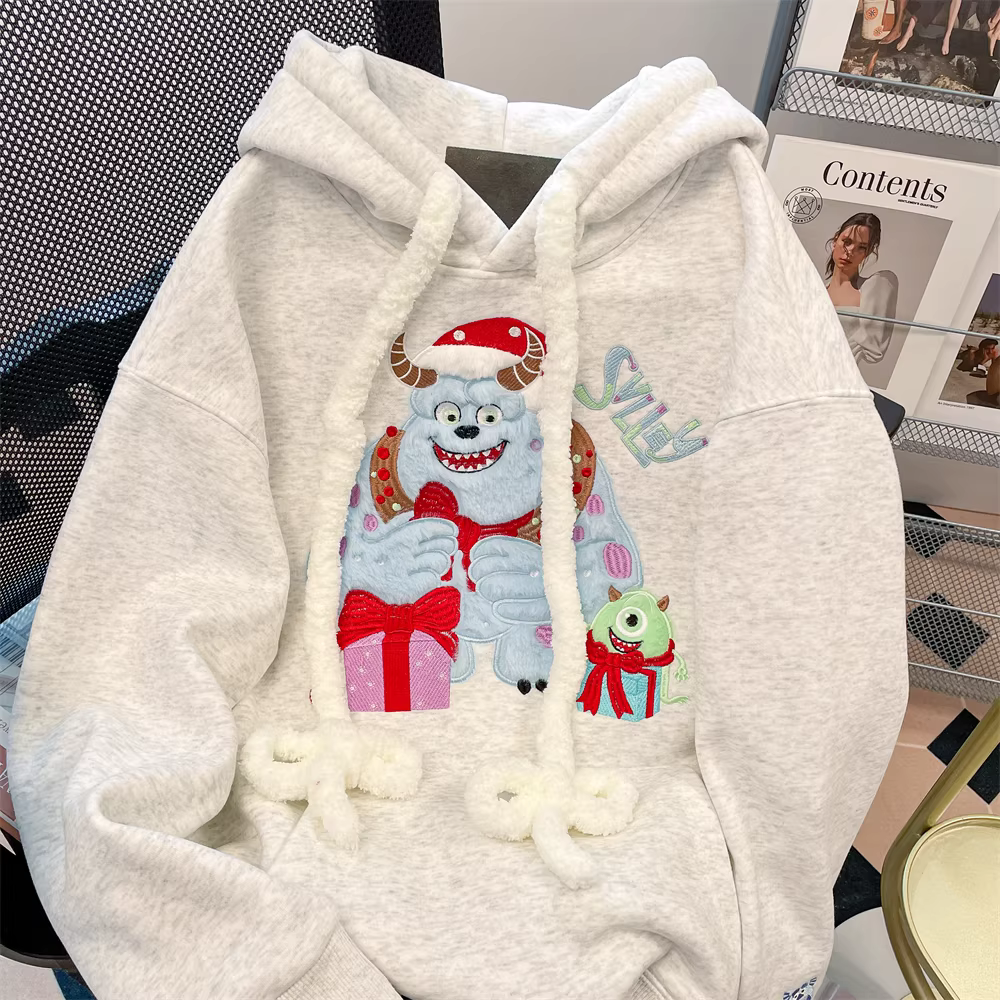 Áo khoác có mũ trùm đầu thêu hình quái vật hoạt hình phong cách Hàn Quốc dành cho nữ 2024 mới mùa thu đông phong cách lười biếng áo khoác dày lót lông cừu