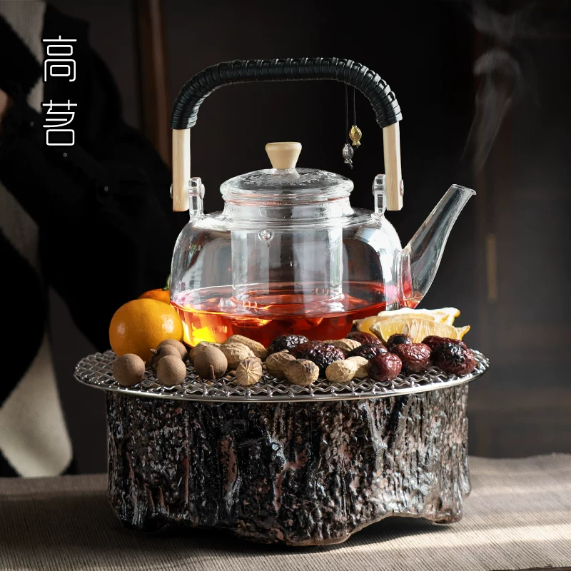 Bộ dụng cụ pha trà hoàn chỉnh xung quanh bếp, máy pha trà bằng bếp điện gốm sứ kiểu Trung Quốc, pha trà và rang trà trong nhà, ấm trà thủy tinh gia dụng.