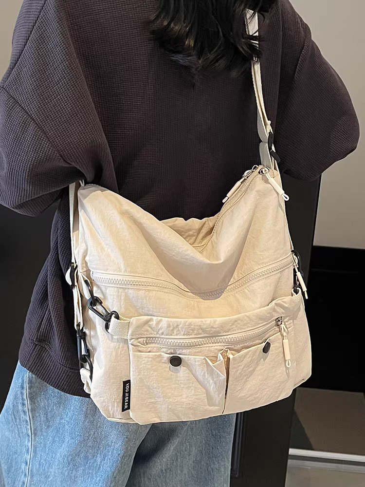 Túi vải canvas dành cho nữ, sức chứa lớn, túi đeo chéo vai mùa hè mới 2025, ba lô đi làm đa năng phong cách Hàn Quốc giản dị