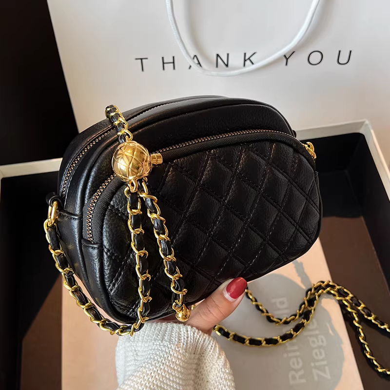 Túi xách nhỏ nữ 2025 thu đông mới cao cấp độc đáo đa năng phối dây xích thời trang hot túi đeo chéo