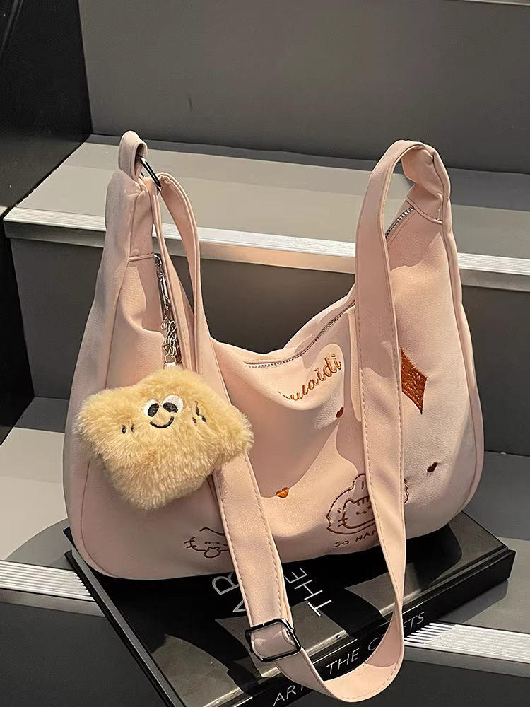 Túi xách nữ cỡ lớn dành cho mùa xuân hè, kiểu dáng mới đa năng năm 2025, thiết kế đơn giản độc đáo, túi đeo chéo một bên vai, túi bánh bao đi làm.