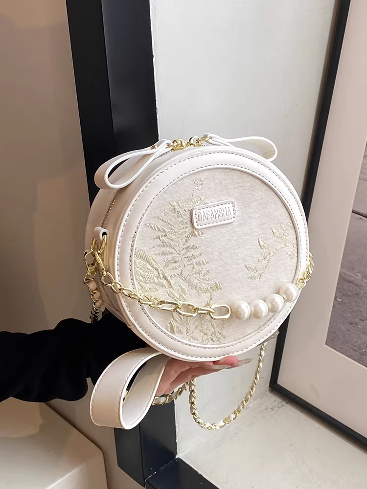 Túi xách nữ theo xu hướng quốc dân kiểu Trung Quốc mới, túi đeo chéo dây xích độc đáo mùa thu đông 2025, túi tròn nữ đang thịnh hành trên Instagram.