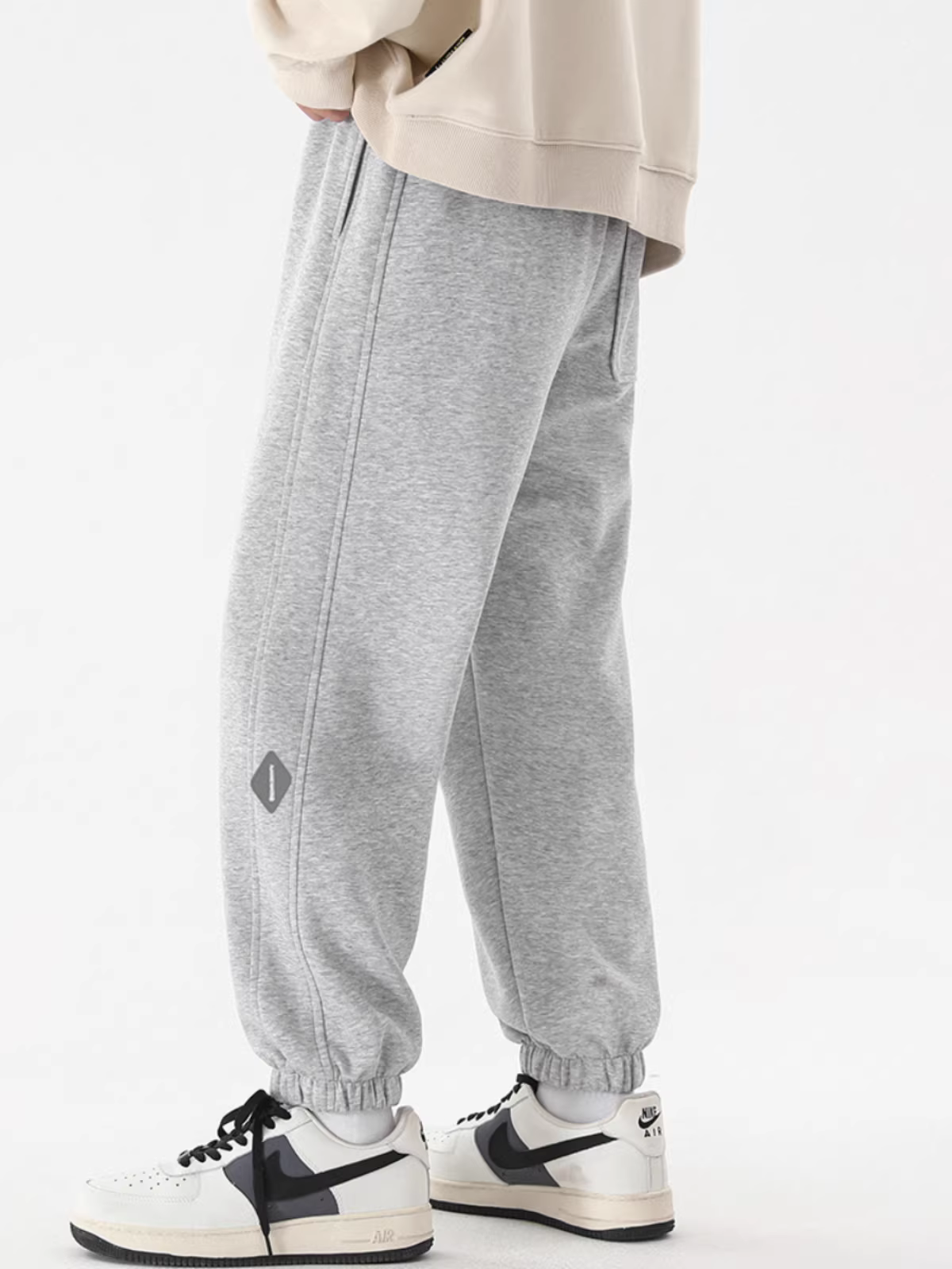 Quần jogger nam màu đen chất liệu dày dặn, kiểu dáng rộng rãi mùa thu có dây rút, quần thể thao đa năng thời trang dành cho thanh thiếu niên.