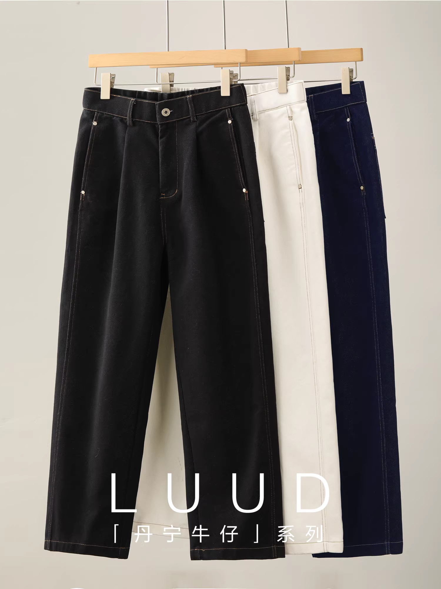 Quần jean ống rộng thẳng chất liệu denim thô LUUD dành cho nam, mùa thu đông, phối màu với đường may nổi bật và kiểu dáng cắt xén.