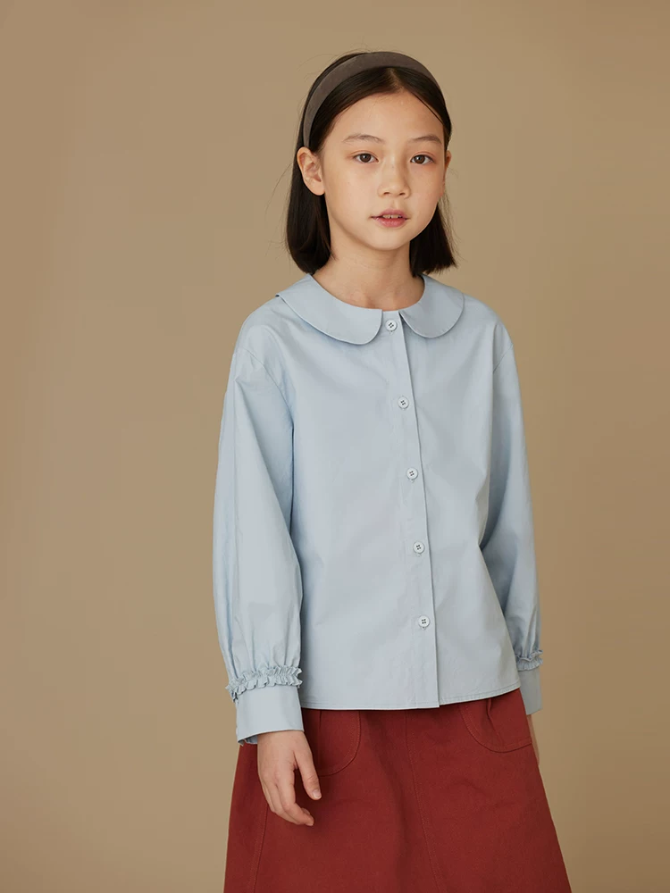 Quần áo trẻ em Hazi 2025 Áo trẻ em xuân thu phong cách Nhật Bản Áo sơ mi dài tay cổ búp bê bằng vải cotton toàn bộ dành cho trẻ lớn hơn