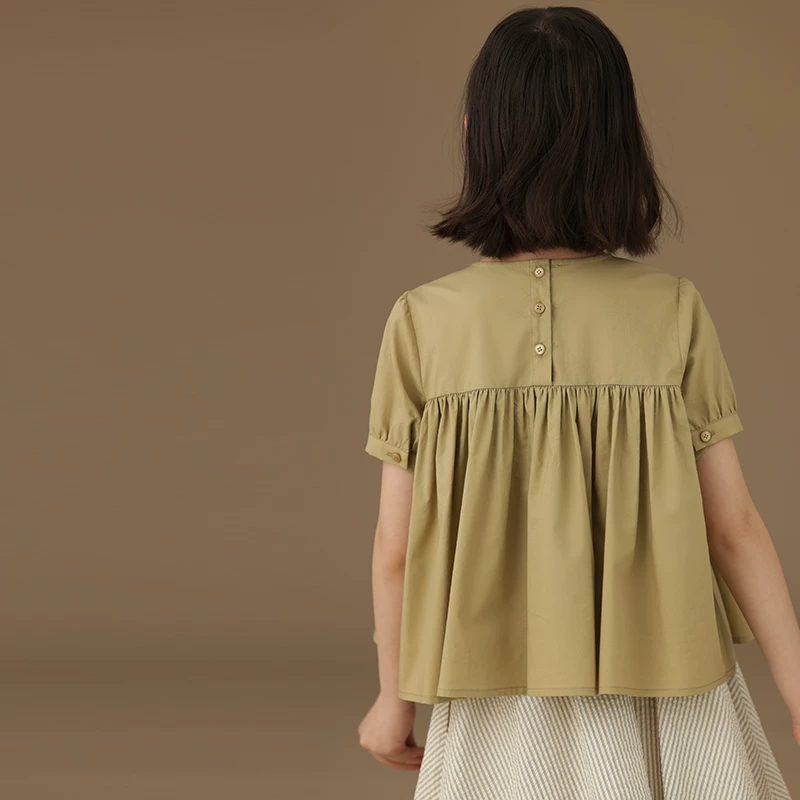 Áo sơ mi ngắn tay trẻ em màu xanh lá cây của Ha Chi Kids, kiểu dáng mùa hè mới 25, áo sơ mi búp bê cho bé gái, sành điệu và thời trang.