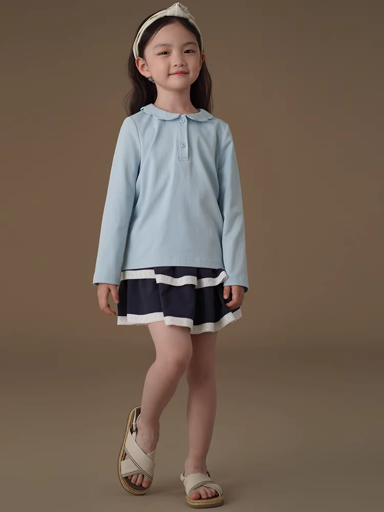 Quần áo trẻ em Hazi Áo sơ mi dài tay mùa xuân thu màu xanh da trời đơn giản kiểu dáng ôm sát dệt kim Áo bé gái mặc mùa xuân 2025 kiểu mới