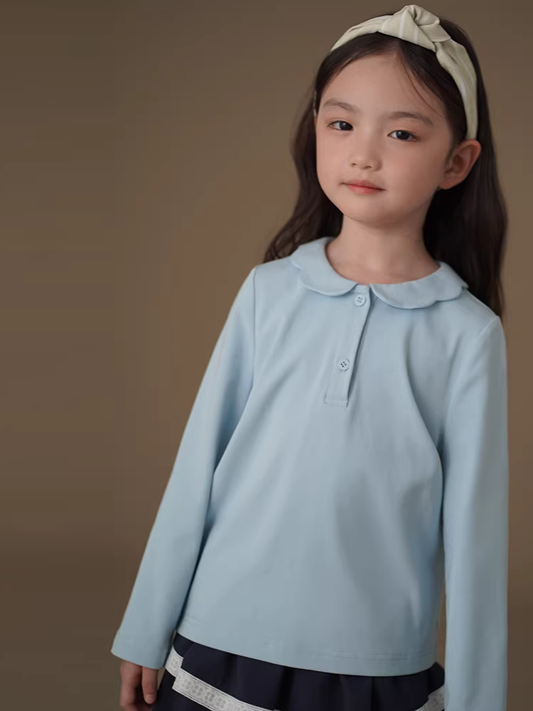 Quần áo trẻ em Hazi Áo sơ mi dài tay mùa xuân thu màu xanh da trời đơn giản kiểu dáng ôm sát dệt kim Áo bé gái mặc mùa xuân 2025 kiểu mới