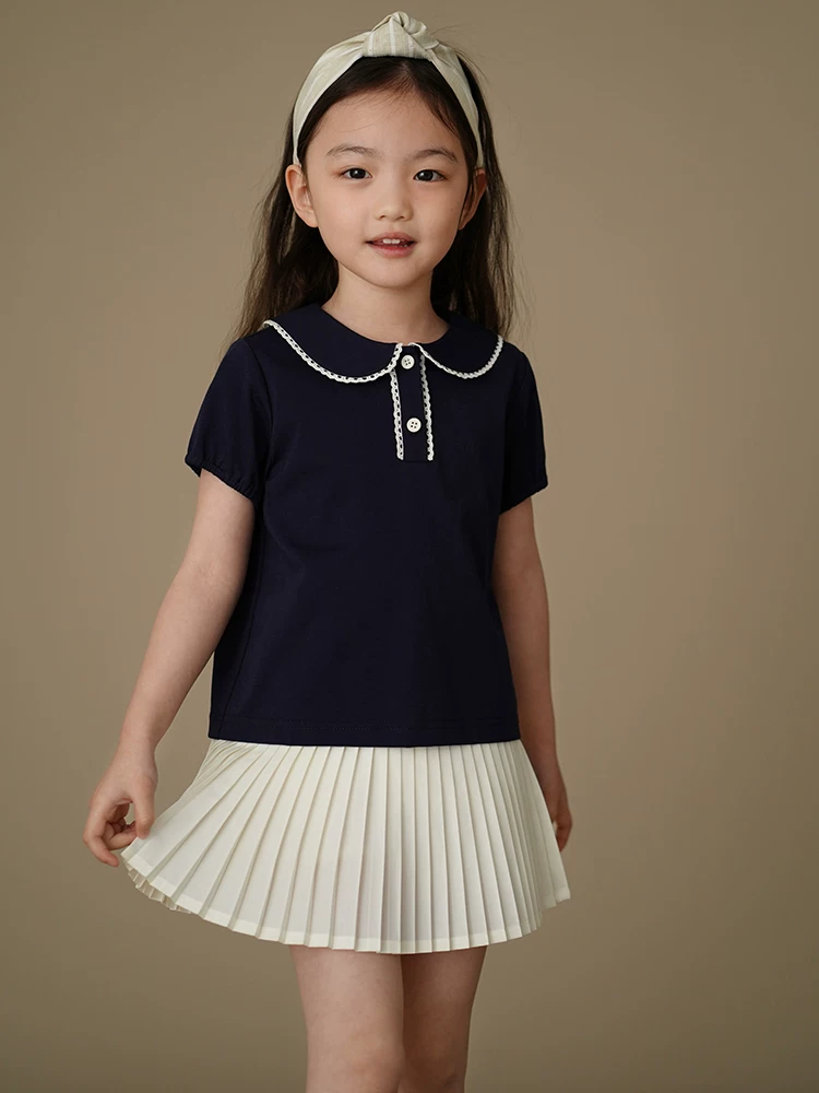 Quần áo trẻ em Hazi Bộ sưu tập mùa hè mới 2025 Áo len cổ búp bê màu xanh hải quân Áo thun ngắn tay cho bé gái