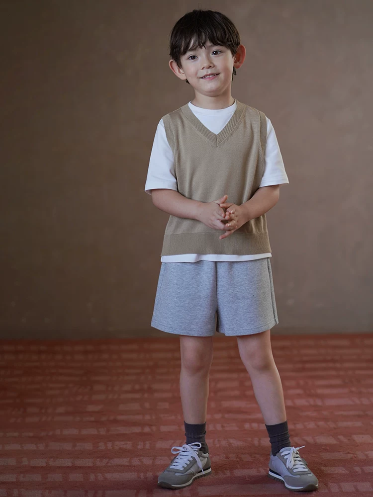 Quần áo trẻ em áo dệt kim mùa xuân thu áo vest kaki đơn giản đa năng áo sơ mi cơ bản cho bé trai và bé gái mang lại cảm giác cao cấp