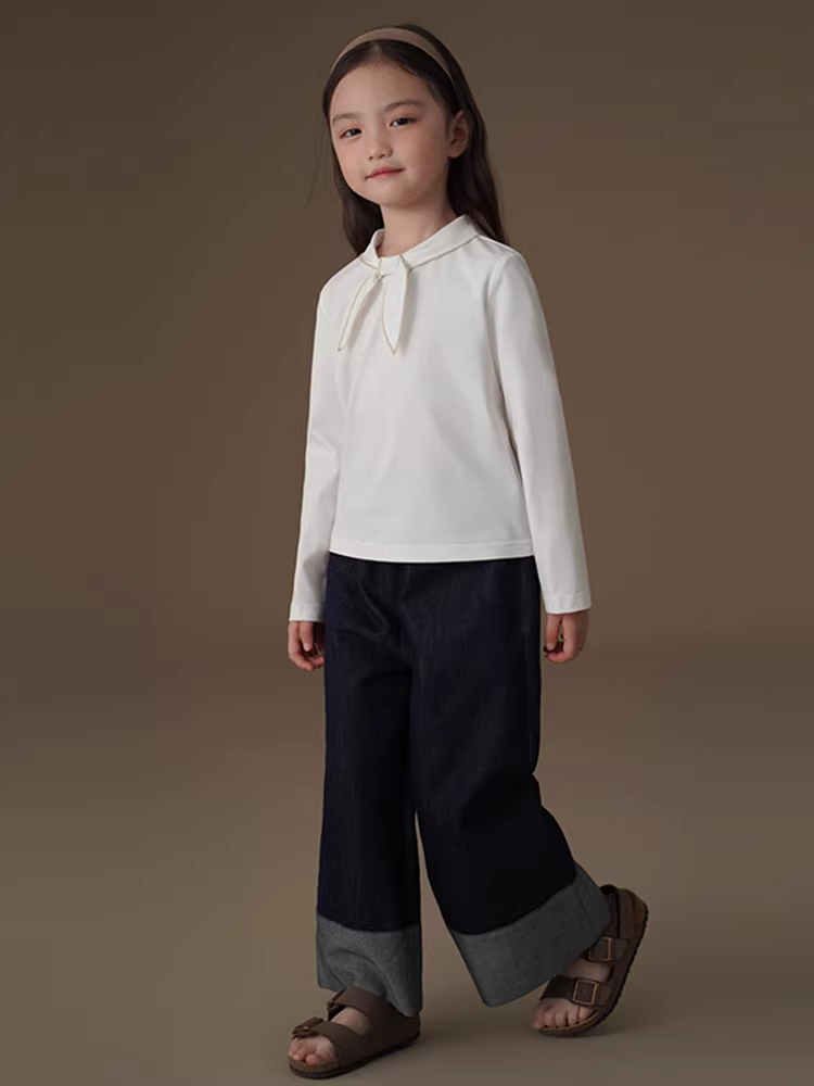 Áo thun bé gái tay dài màu trắng, kiểu dáng dễ thương, phối nơ, chất liệu len, thích hợp cho mùa xuân thu.