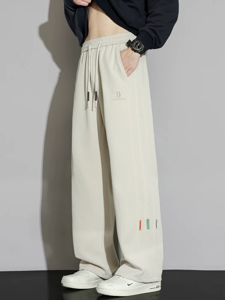 Quần dài ống suông kiểu Mỹ của Jeanswest dành cho nam, mùa xuân thu, cảm giác cao cấp, dáng rộng, có dây rút, quần dài đa năng.