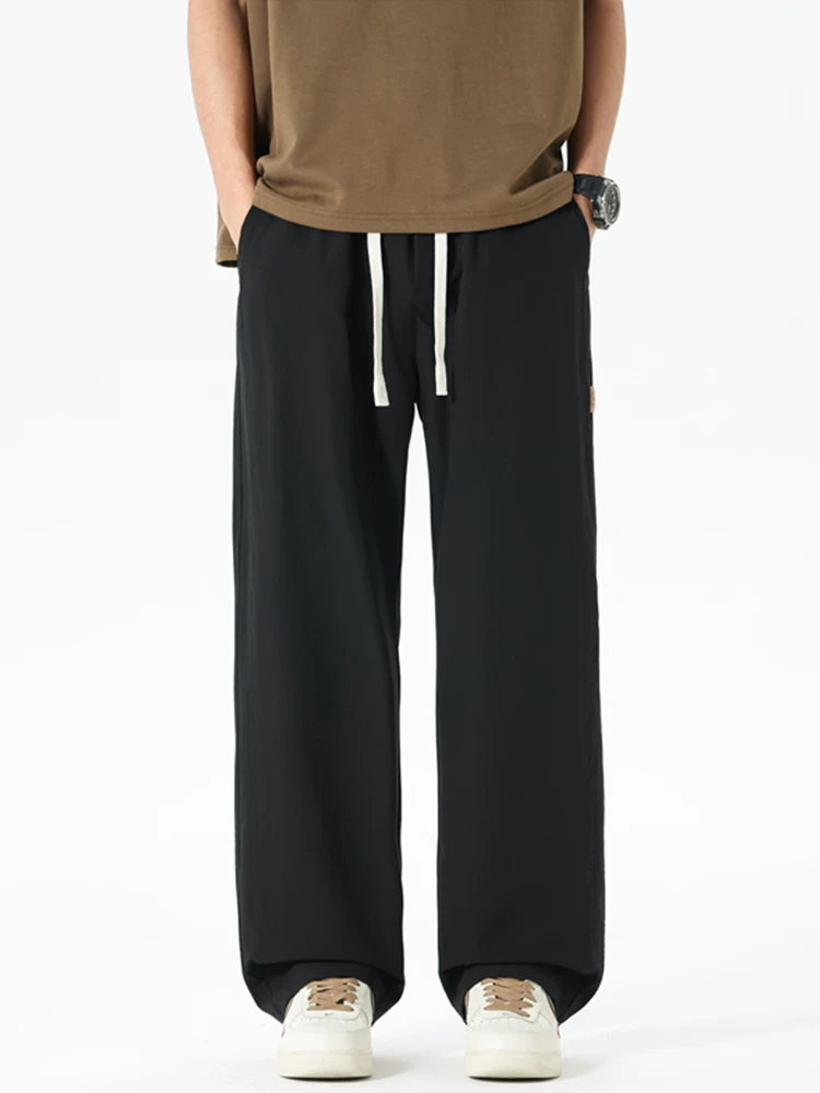 Quần jeanswest ống rộng phong cách Mỹ thời thượng dành cho nam, mùa xuân thu, dáng rộng cao cấp, quần thể thao đa năng.