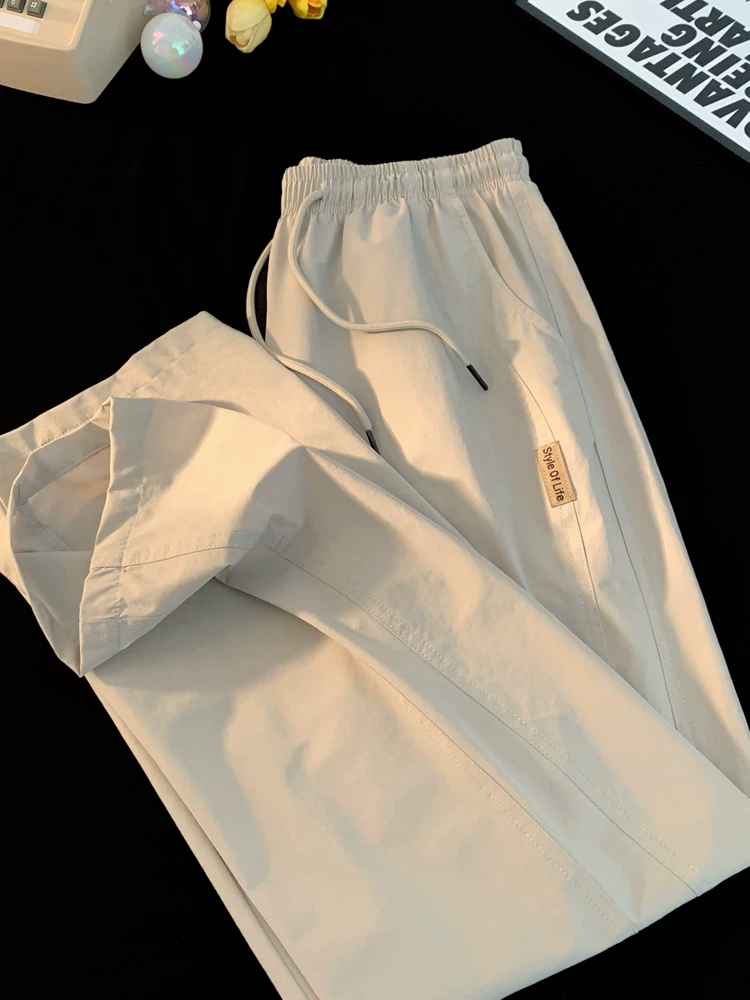 Quần ống đứng cao cấp phong cách tối giản kiểu Nhật của Jeanswest dành cho nam, quần ống rộng đa năng, chất liệu lụa băng mỏng, thoải mái, mặc mùa hè.