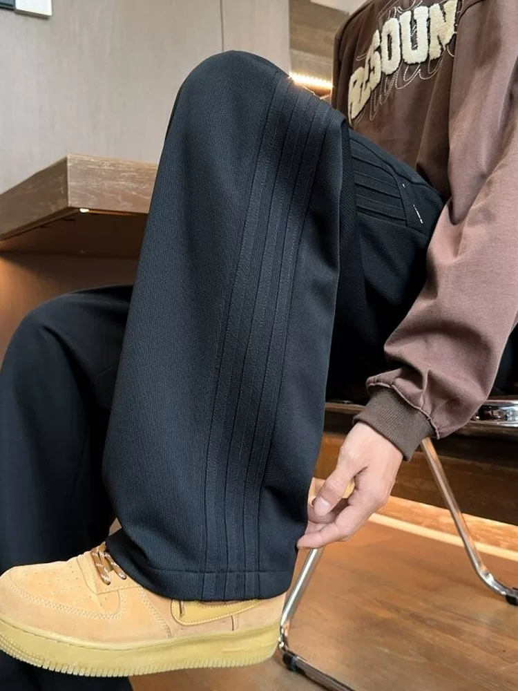Quần dài ống đứng màu đen phong cách Mỹ của Jeanswest dành cho nam, mẫu mới mùa xuân 2026, quần dài cao cấp, quần thể thao.