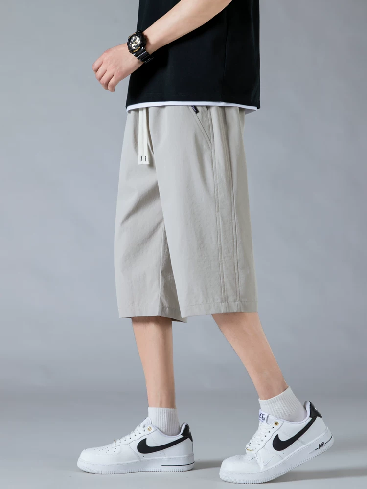 Quần short đa năng hợp thời trang Jeanswest Ice Silk Thin dành cho nam, quần dài bảy phần tư rộng rãi, thoáng khí, nhanh khô, phong cách thường ngày mùa hè.