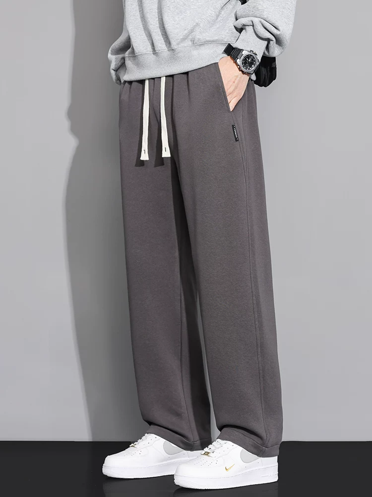 Quần jeanswest ống rộng dáng suông dành cho nam, quần thể thao dáng rộng màu trơn hợp thời trang mùa xuân.