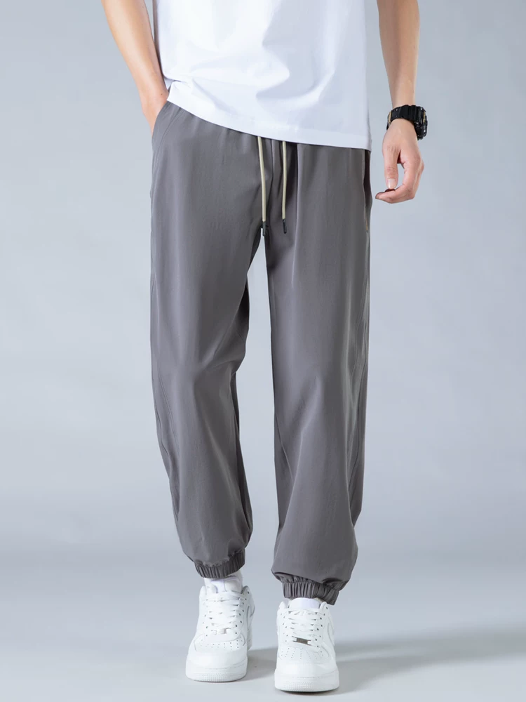 Quần jogger nam Jeanswest Ice Silk mỏng kiểu Mỹ thời trang thương hiệu nổi tiếng mùa hè 2025 mới, dáng rộng, đa năng, phong cách thường ngày