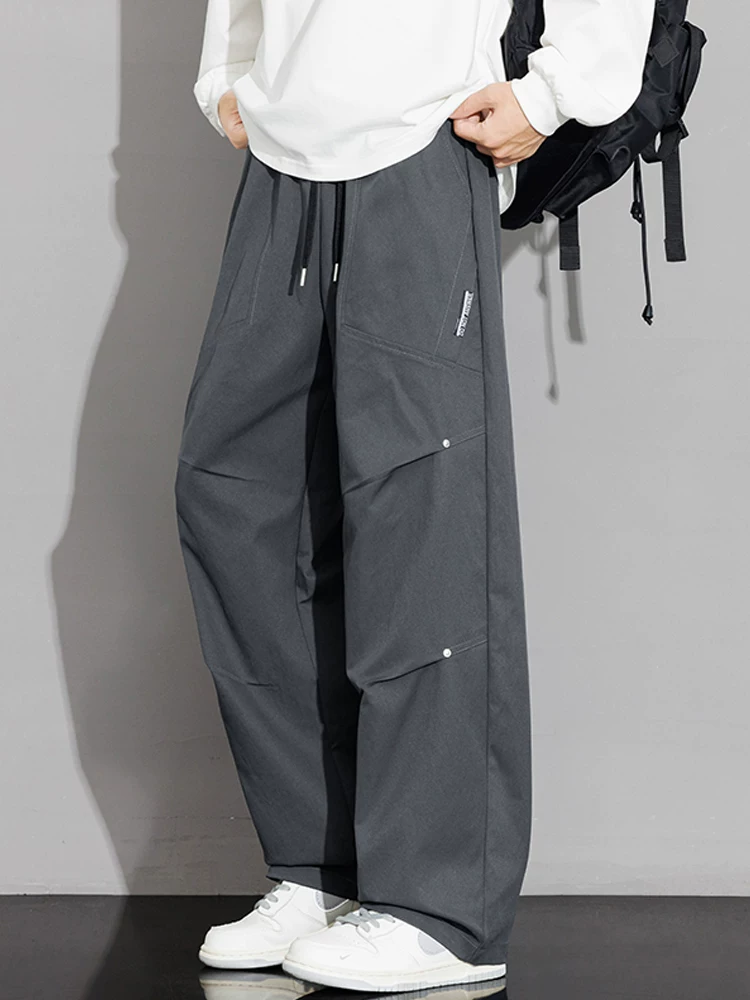Quần dài ống rộng phong cách Mỹ của Jeanswest dành cho nam, quần dài ống rộng đa năng, thương hiệu thời trang xuân thu cao cấp.