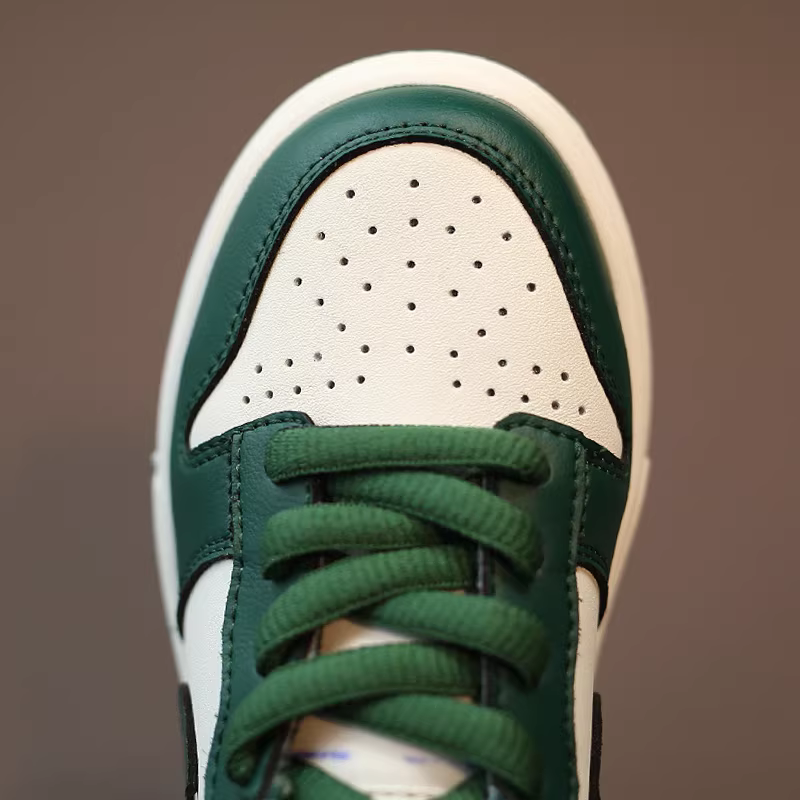 Giày thể thao da thật trẻ em 2025 mẫu mới xuân thu, giày chống trơn cho bé trai, giày trẻ em đen trắng, giày panda trắng thời trang