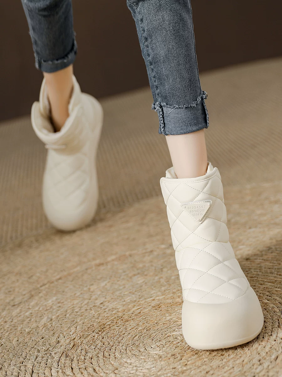 Giày bốt nữ da thật đế dày chống trượt, giày bông Đông Bắc, kiểu mới mùa đông 2025, lót lông cừu, dày dặn, ấm áp, bốt ngắn.