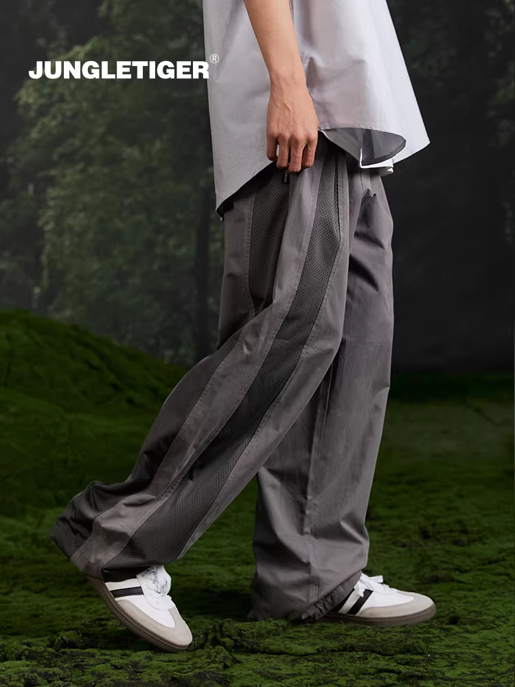 Quần thể thao nam dáng rộng phong cách đường phố mới 2025, kiểu phối màu chắp vá thời thượng Jungle Tiger