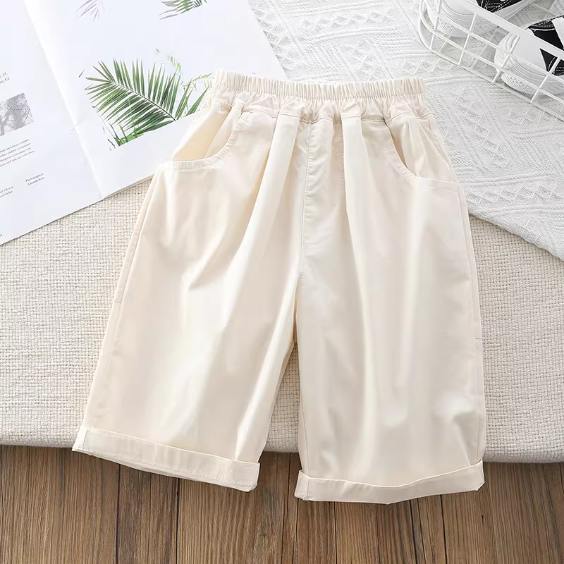 Quần trẻ em trơn màu hè 2025 kiểu mới quần lửng bé trai nhanh khô mỏng quần bảy phần quần đùi trẻ em thời trang