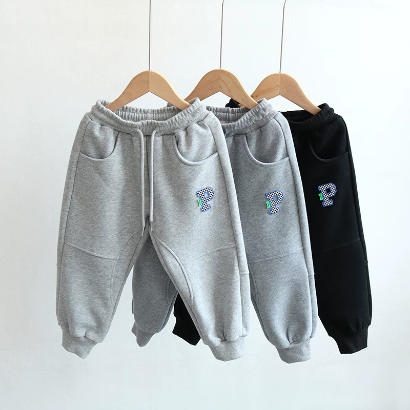 Quần thể thao trẻ em xuân thu 2025 kiểu Hàn Quốc mới, quần jogger cotton nguyên chất thời trang cho bé trai và bé gái