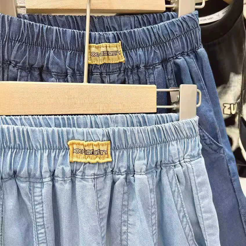Quần short denim bé trai hè 2025, quần short năm phần chất liệu mỏng, kiểu dáng thường ngày cho trẻ lớn, quần ống rộng thoải mái cho trẻ em, kiểu dáng thời thượng