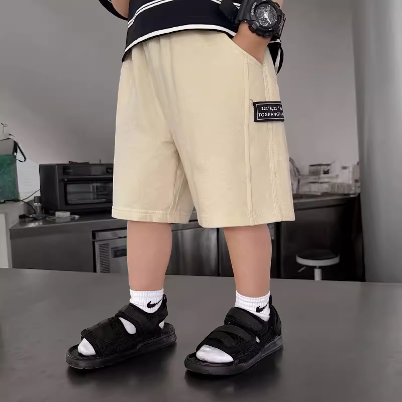 Quần short thể thao mùa hè mỏng cho bé trai 2025 phong cách Hàn Quốc thời trang trẻ em chất liệu cotton nguyên chất thoáng khí dài đến đầu gối thích hợp mặc ngoài trời