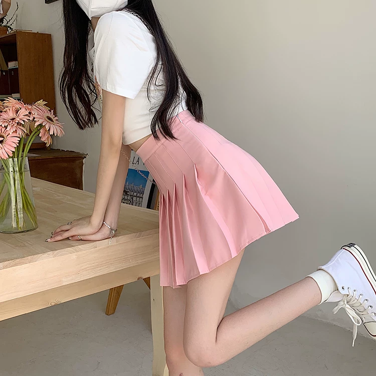 Váy xếp ly màu hồng giảm béo cỡ lớn dành cho nữ, váy chữ A cạp cao che hông mùa hè, váy ngắn chống lộ phong cách học sinh.