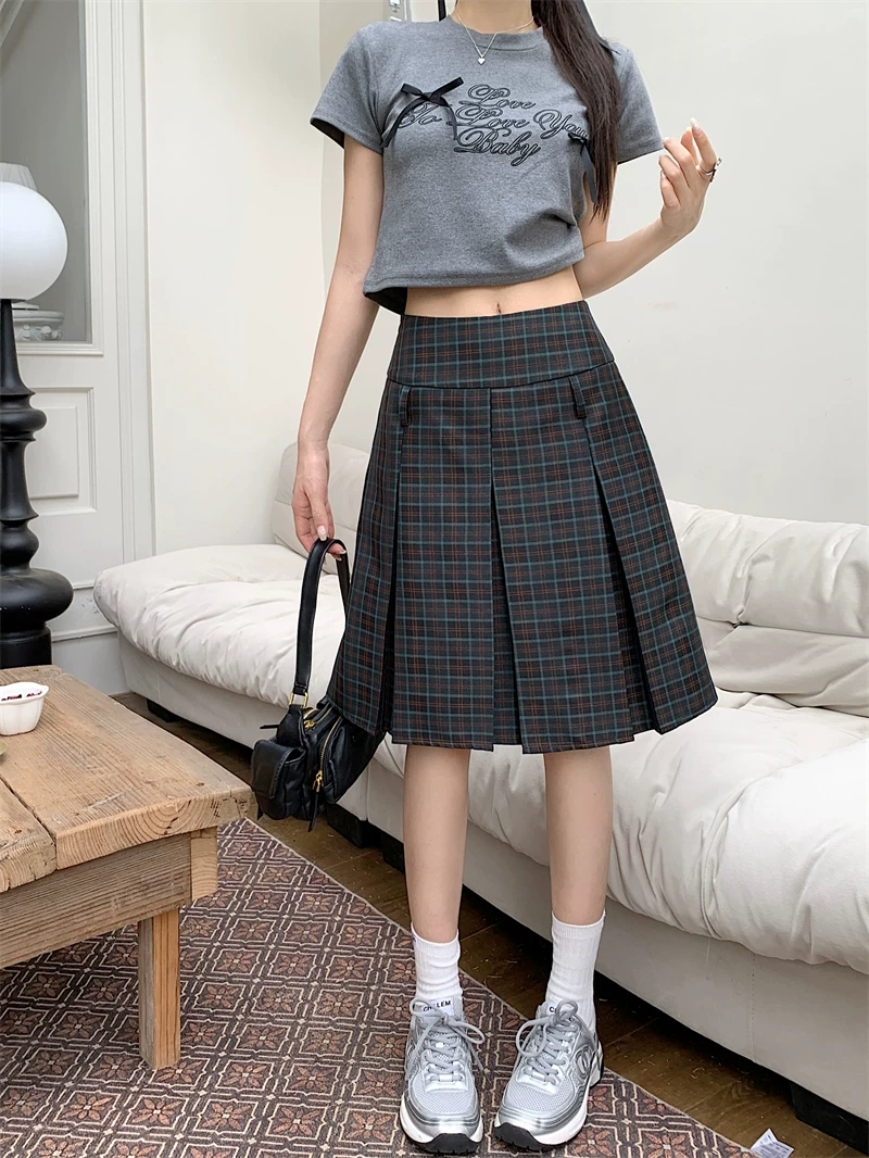 Váy xếp ly kẻ sọc cổ điển kiểu Mỹ, váy ngắn chữ A cỡ lớn dành cho nữ, váy kiểu học sinh cạp cao dành cho phụ nữ nhỏ nhắn.