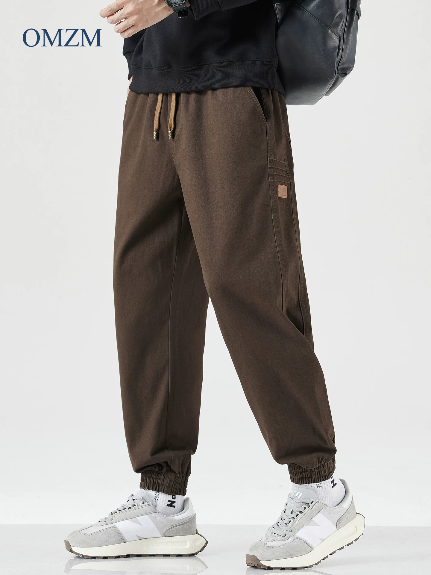 Quần cargo hạng nặng OMZM dành cho nam, quần ống côn dáng rộng mùa thu mang lại cảm giác cao cấp, quần thể thao kiểu harem phong cách Mỹ mát mẻ và sành điệu.