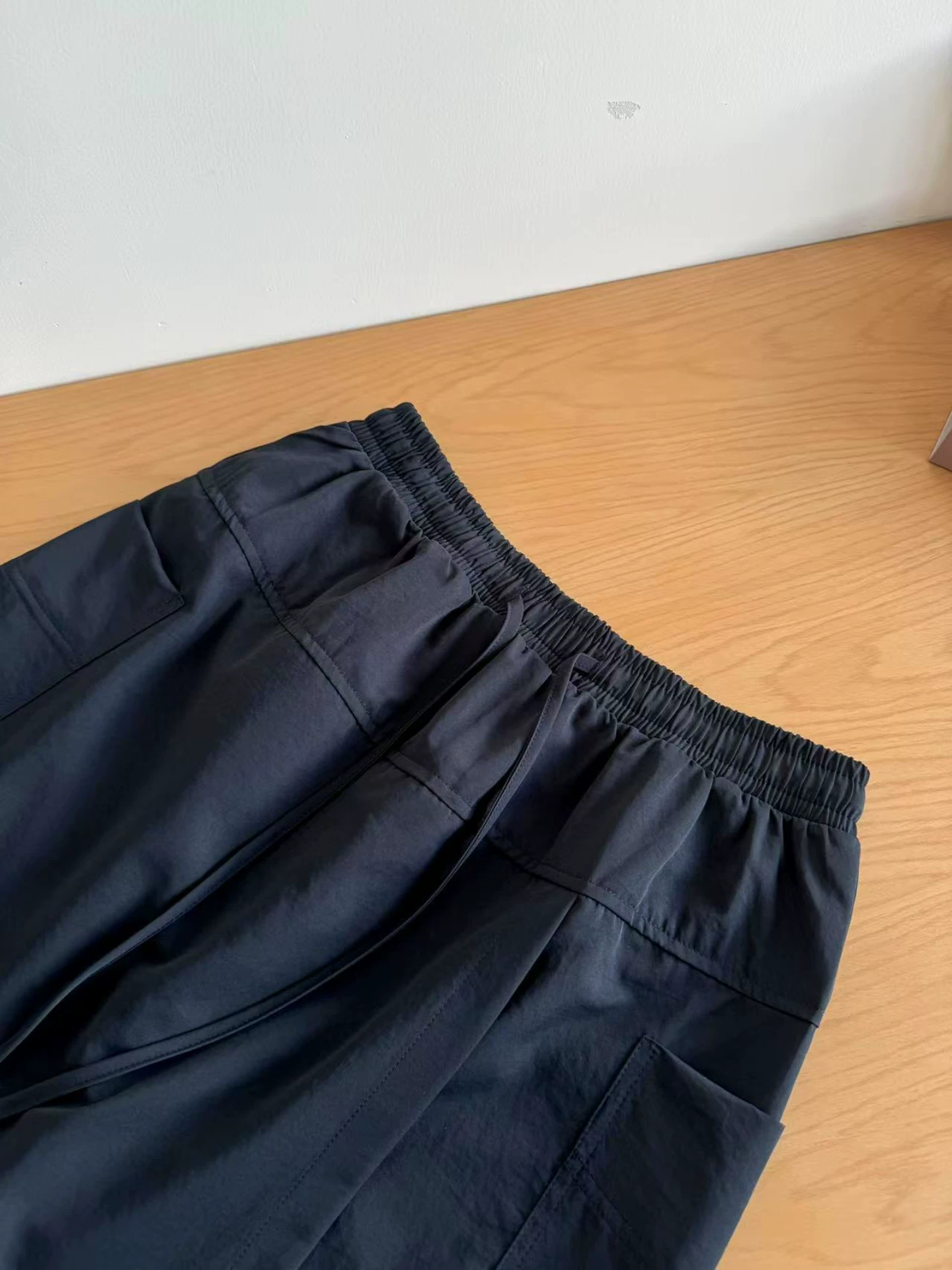 Váy quần công sở màu xanh hải quân dành cho nữ, kiểu dáng mỏng mùa hè 2025, size lớn, cạp cao, che hông, dáng chữ A, ngắn năm phần, tôn dáng.