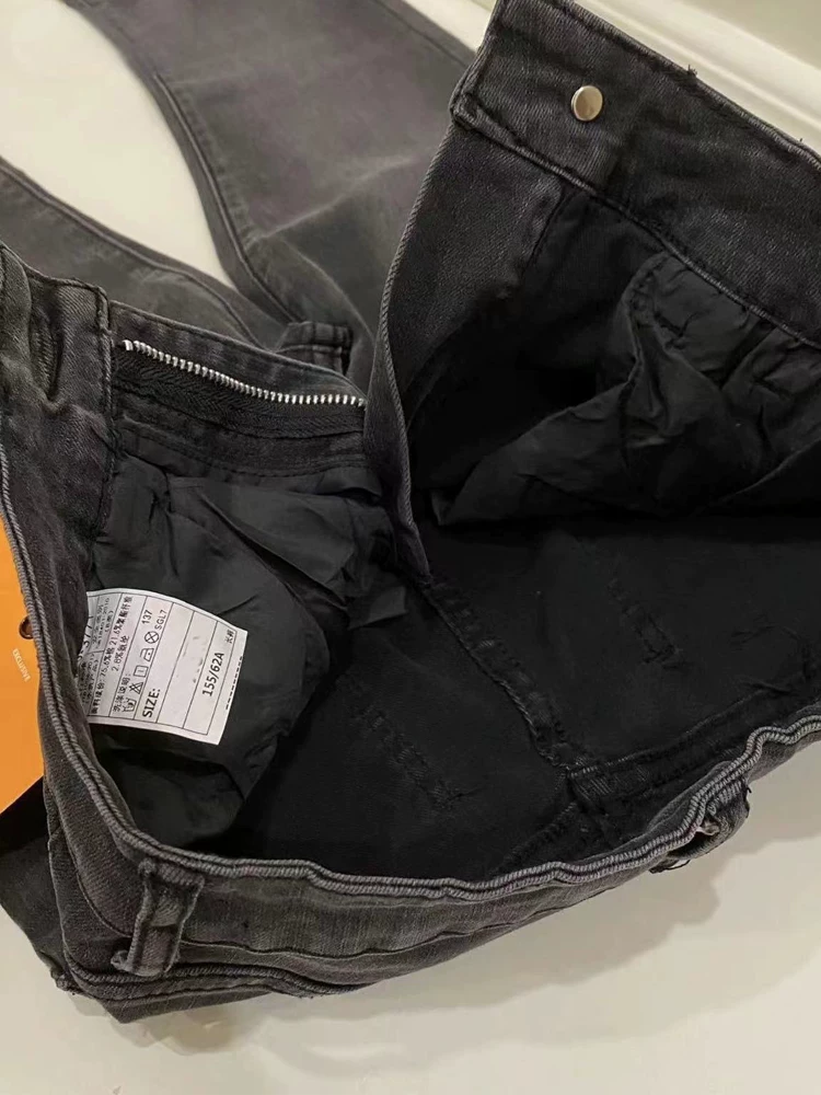 Quần jean xòe viền xù màu đen và xám dành cho nữ, kiểu dáng mùa thu mới, cỡ lớn, lưng cao, che hông, giảm béo, quần ống loe thẳng.